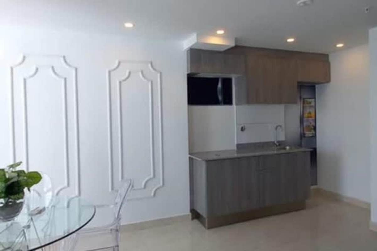 Minimalist kitchen with modern finishes and glass dining table in The Sands Panama