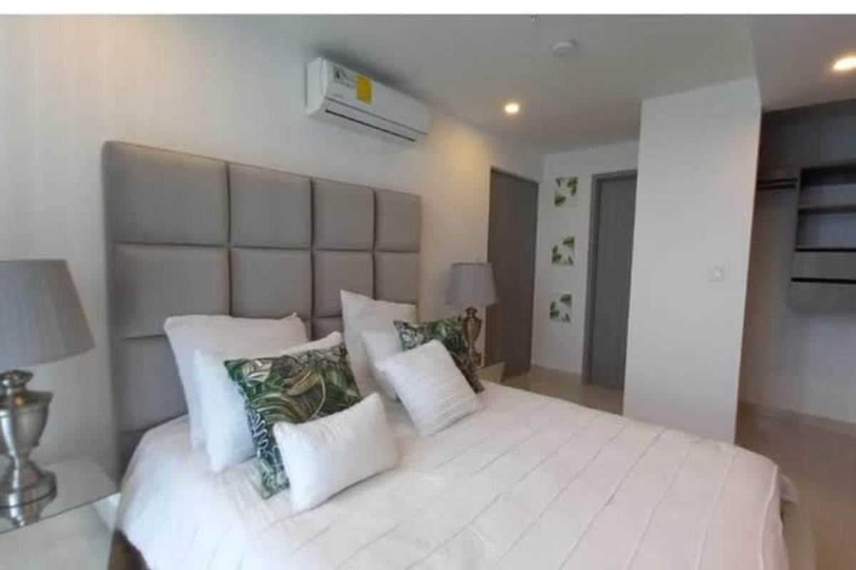 Contemporary bathroom with glass walk-in shower, marble tiles at The Sands Panama City