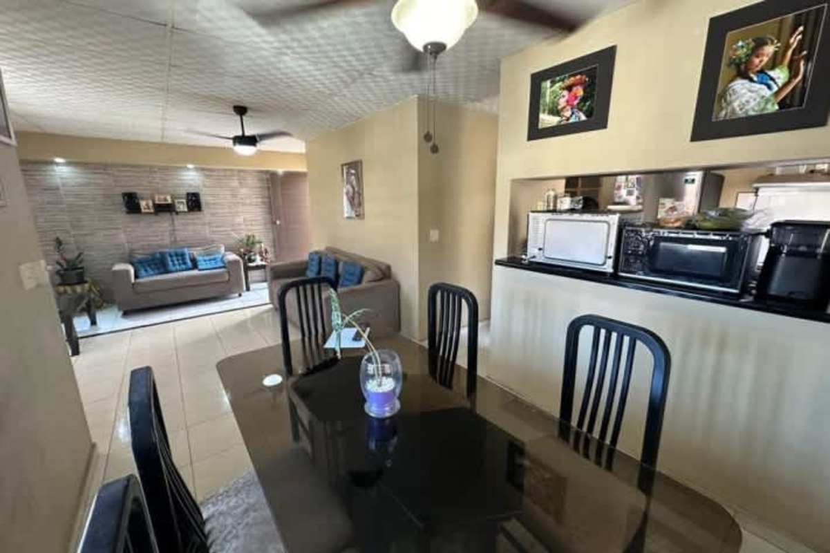 Bright living room tiled floors ceiling fan in house Vista del Valle Villa Lucre Panama