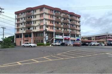 Multi-story PH Doña Ana building exterior with commercial shops La Chorrera Panama