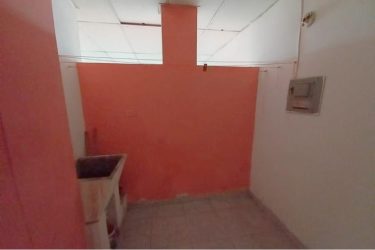 Private balcony with railing overlooking La Chorrera urban cityscape from PH Doña Ana apartment