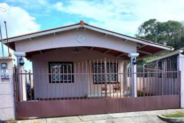 Bedroom with ceramic tiles and bright window at Verde Real La Chorrera Panama