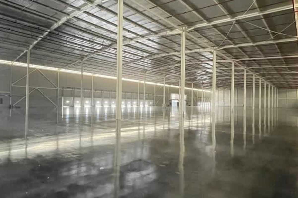 Empty logistics warehouse interior with metal supports and polished floors Panama