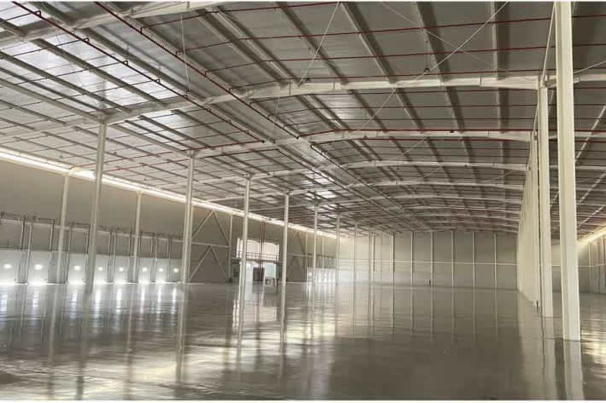 Spacious logistics warehouse interior with concrete floor and steel beams Panama City