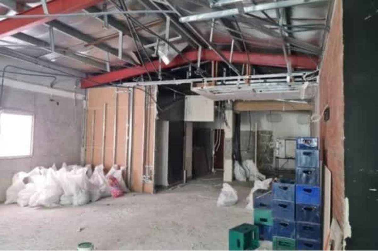 Commercial locale under renovation with exposed wiring and construction materials in Panama City