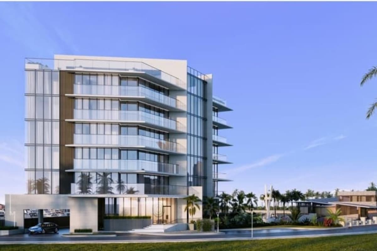 Contemporary living and dining space with marble flooring, floor-to-ceiling windows overlooking ocean and skyline at Ocean Reef Islands Panama