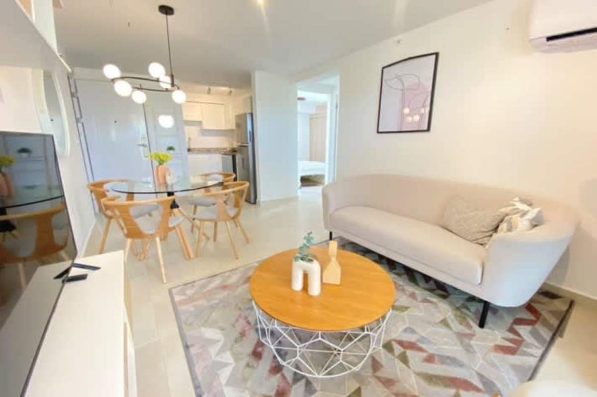 Bright open living and dining area with modern design balcony access Panama Viejo Panama