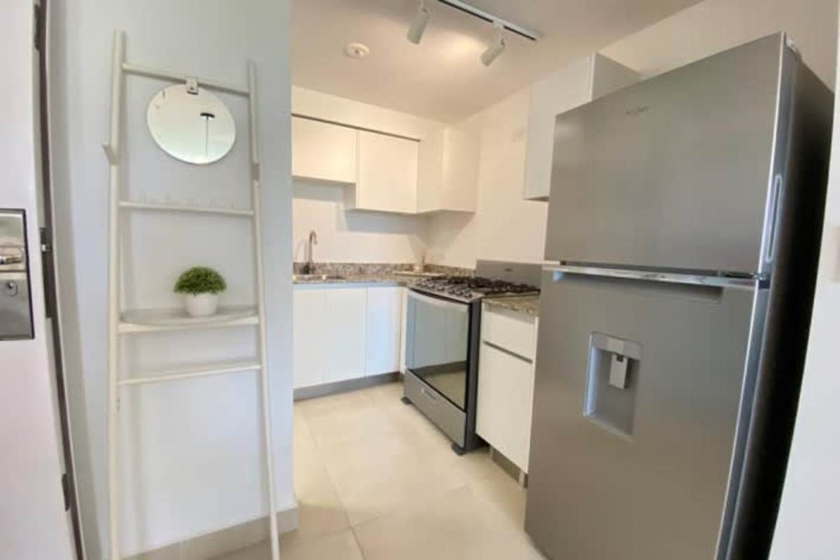 Modern kitchen granite countertops white cabinets Panama Viejo apartment Juan Diaz Panama
