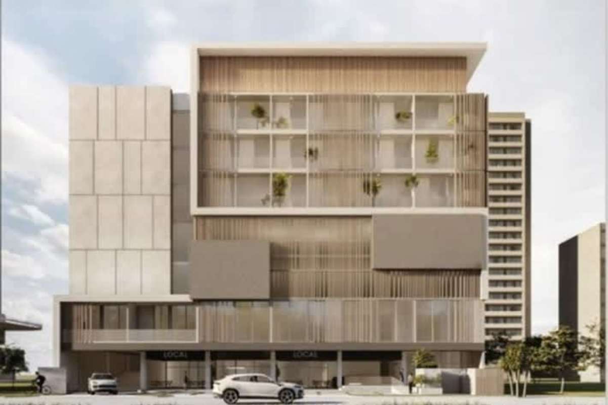 Modern mid-rise building with commercial ground floor and planters in PH Marbella Smart Residences Panama City