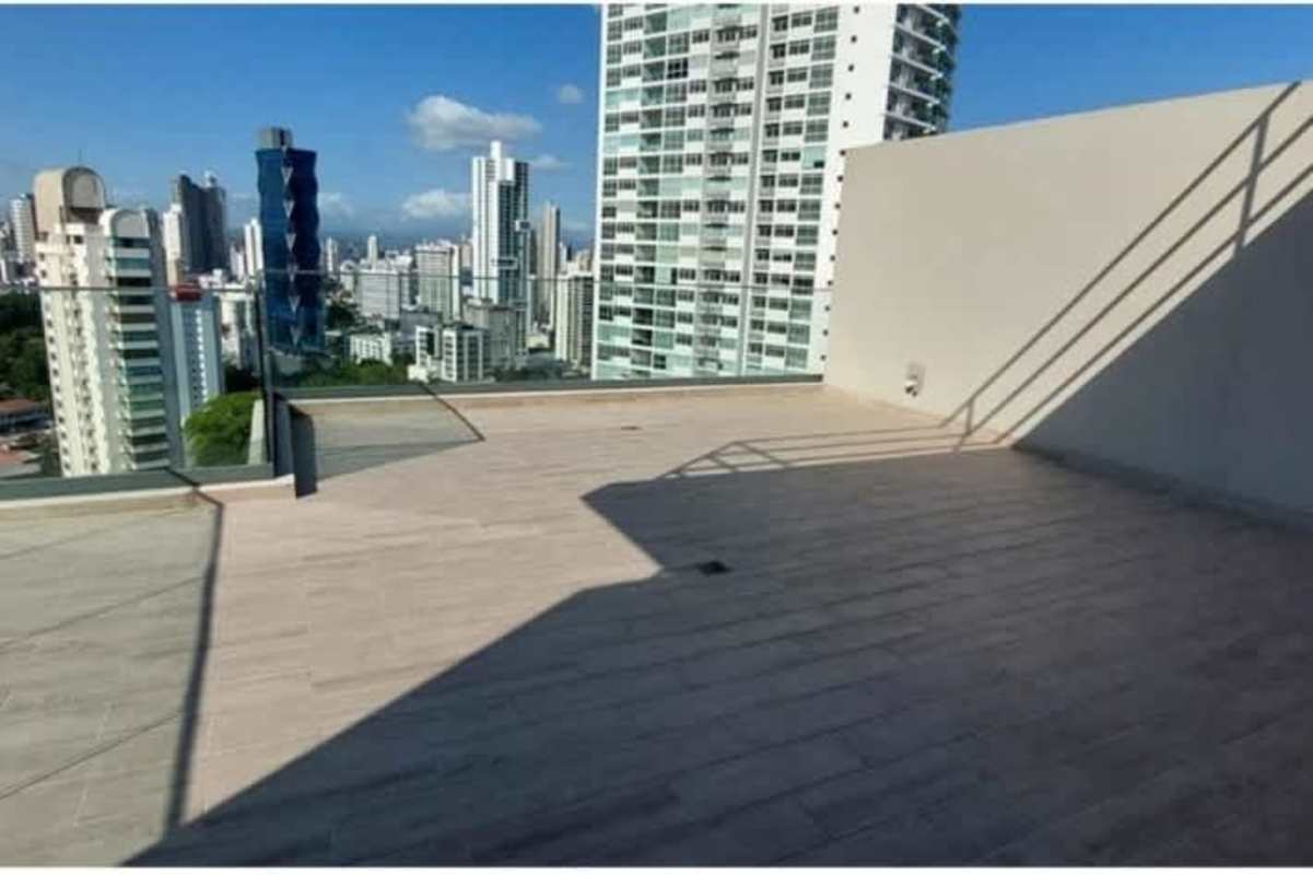 Open concept living room with large windows and panoramic city view Belize Vista Panama apartment