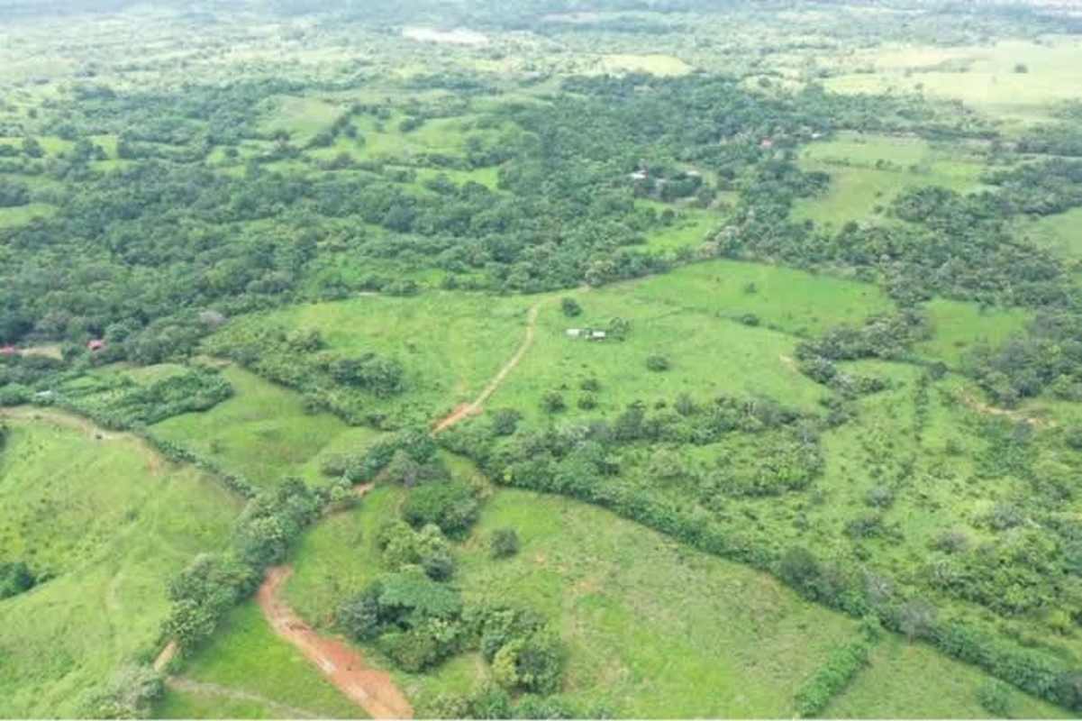 Expansive aerial panorama of rural farm land with hills near Chepo Panama