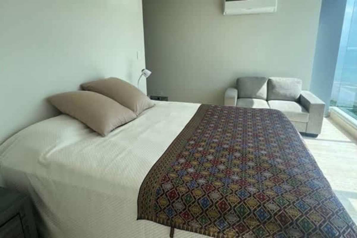 Contemporary living dining area with floor-to-ceiling windows and ocean backdrop Costa del Este Panama