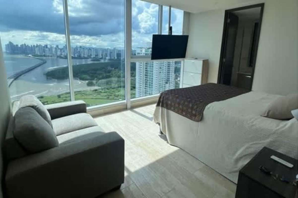 Elegant master bedroom with panoramic water and skyline view, built-in closet and AC in Costa del Este Panama