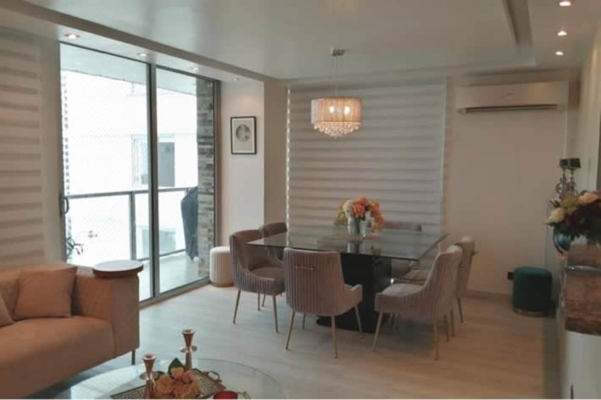 Living and dining space with balcony view of Panama skyline, PH Titanium Tower San Francisco