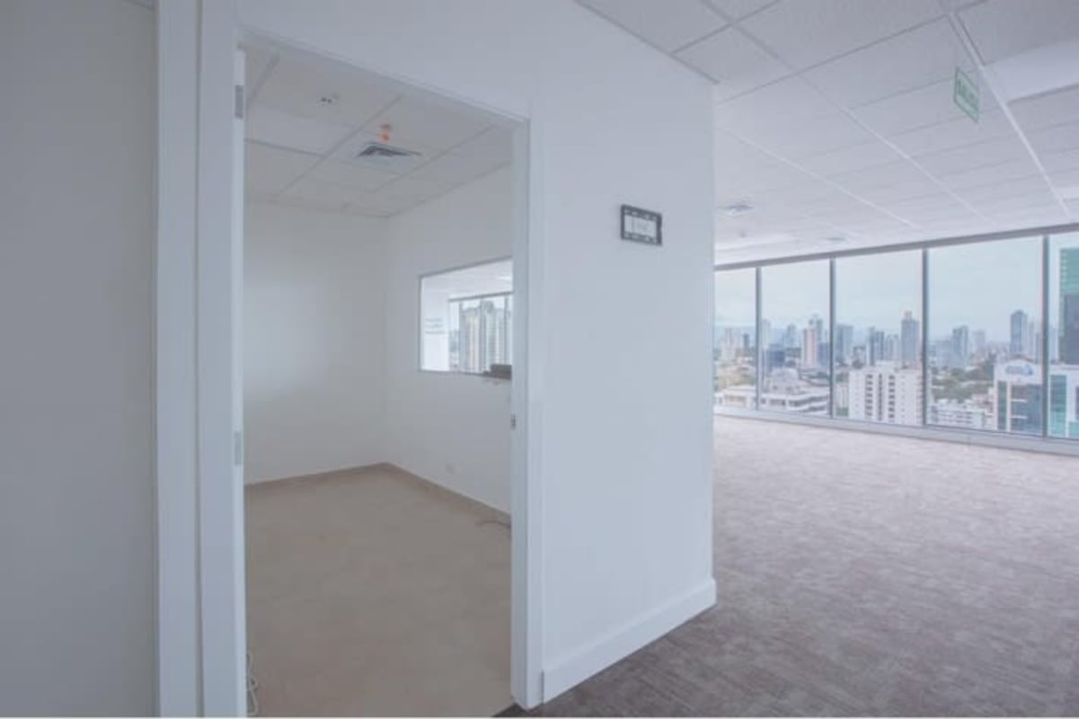 Partitioned commercial office with floor-to-ceiling city view windows inside PH BICSA Financial Center