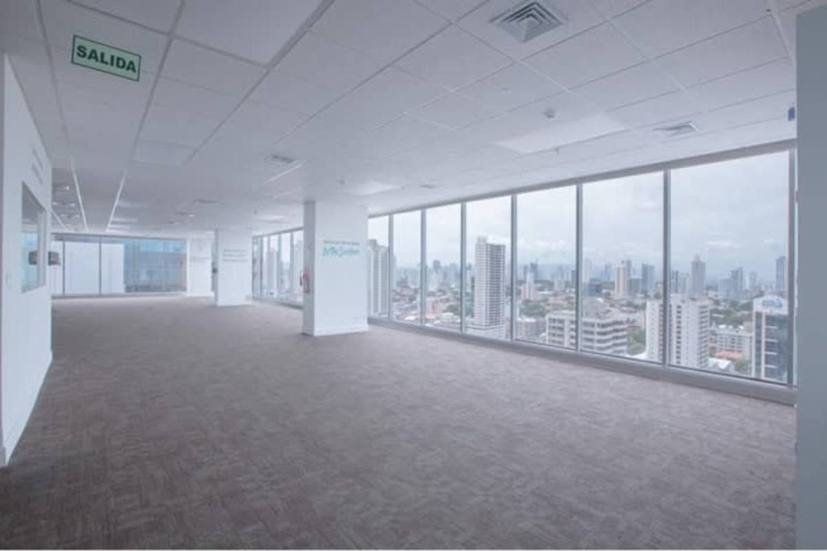 Open modern office space with city skyline views and floor-to-ceiling windows in PH BICSA Financial Center Panama City