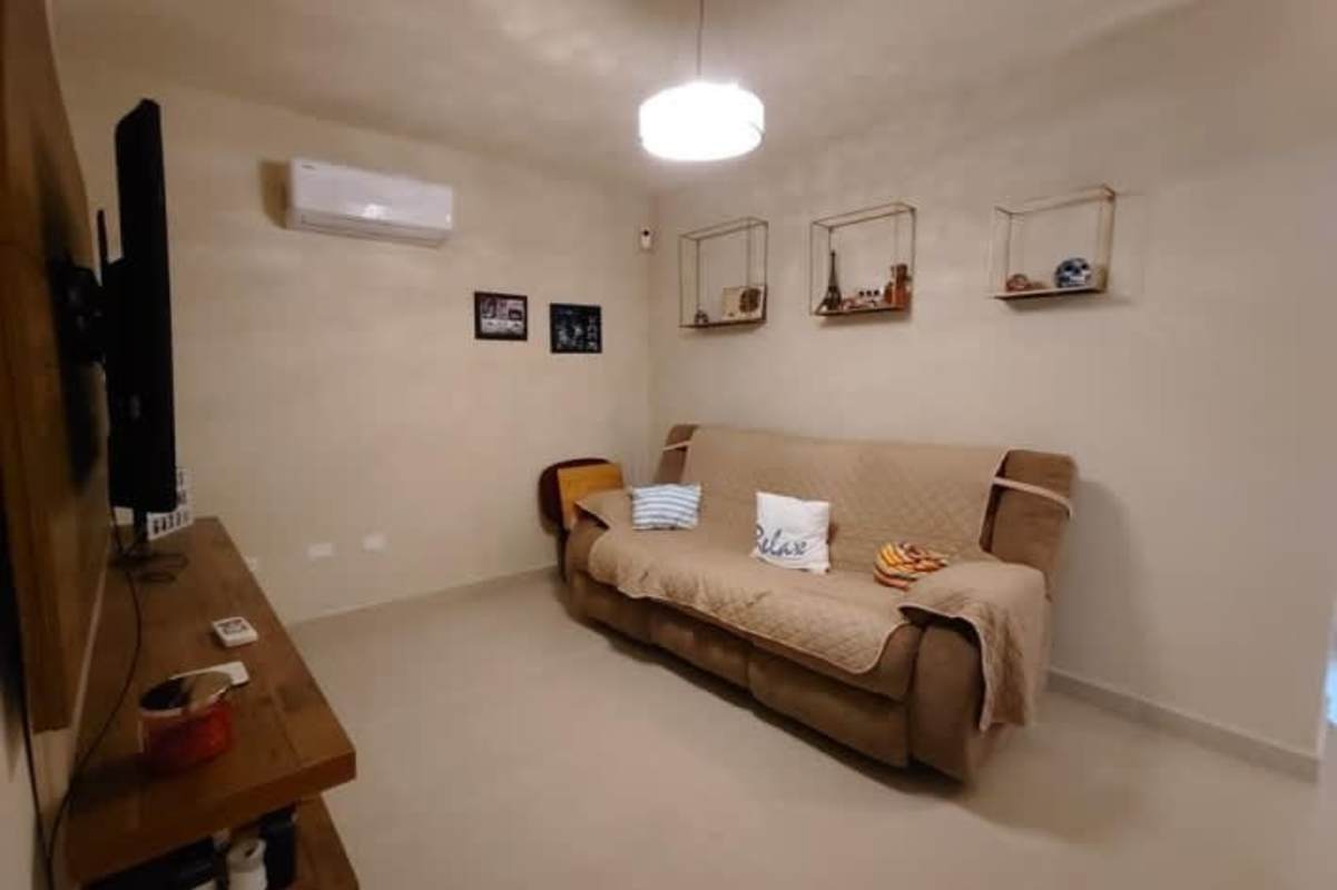 Living room with wall TV, air conditioning, balcony view at PH San Francisco Bay Panama