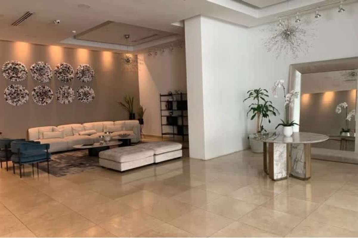 Bathroom with double sinks, granite vanities, glass shower in PH Latitude Panama