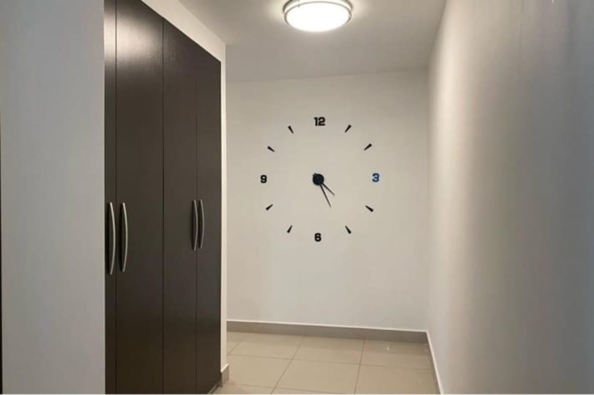 Living room with large sliding doors leading to balcony, city views in PH Latitude Costa del Este