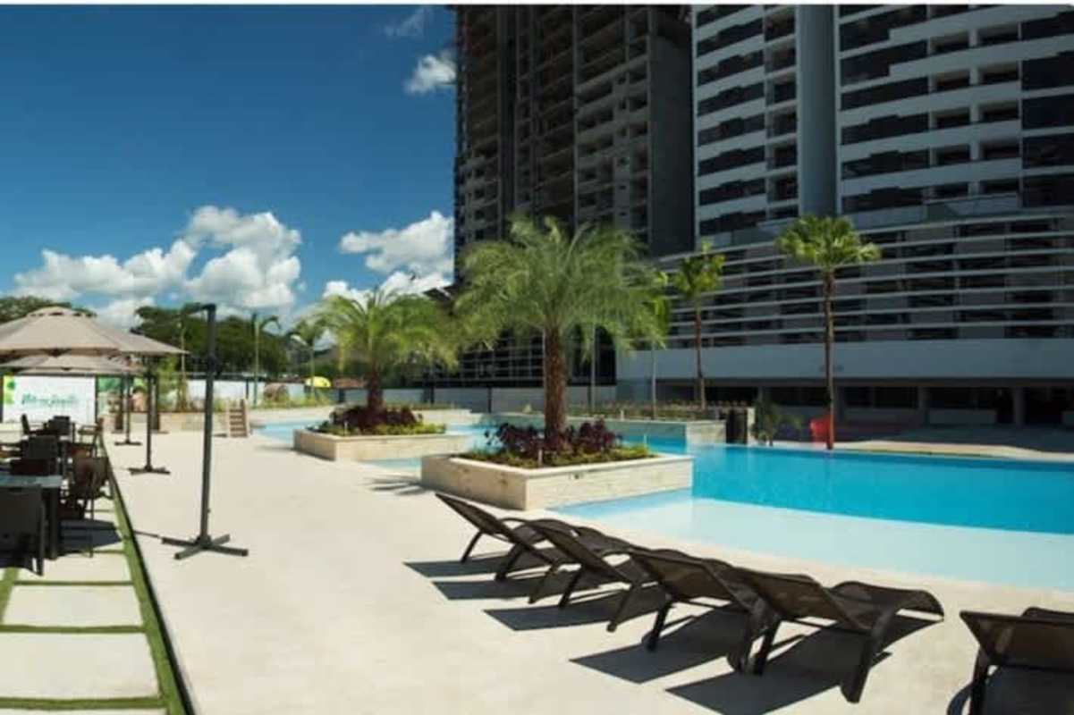 Multiple swimming pools and sun decks at PH Altaterra residential complex Condado del Rey Panama