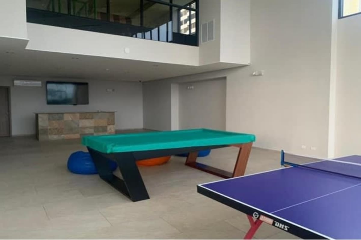 Game room with pool table, lounge area and bar at PH Oceania Costa del Este Panama