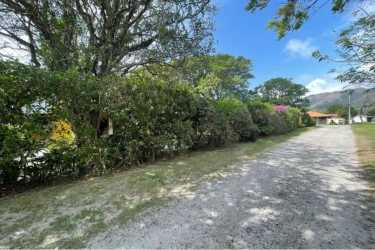 Rustic kitchen with wooden cabinets island granite countertops in country home Panama