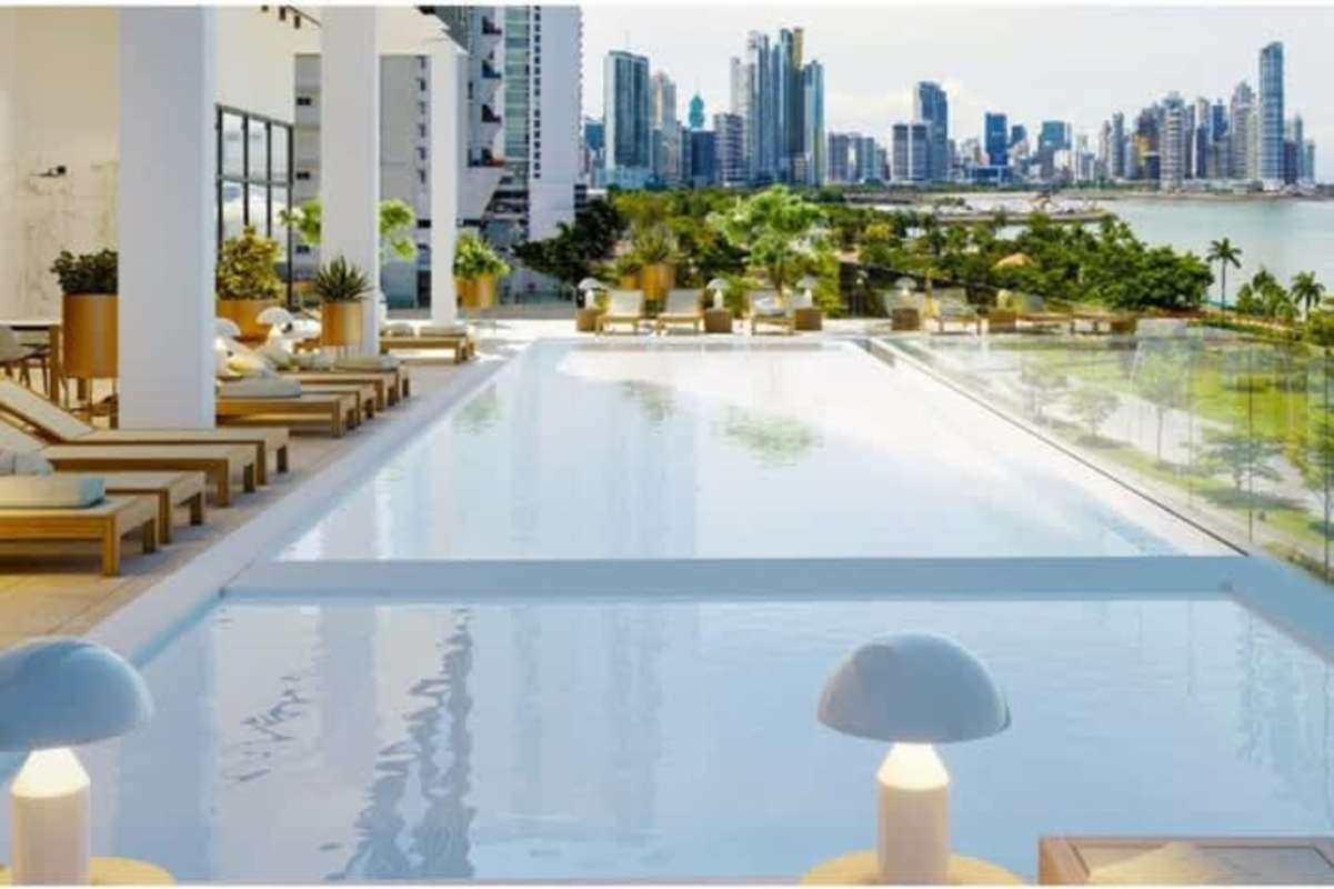 Rooftop infinity pool overlooking city skyline and Pacific coast at The Walker Balboa Panama City