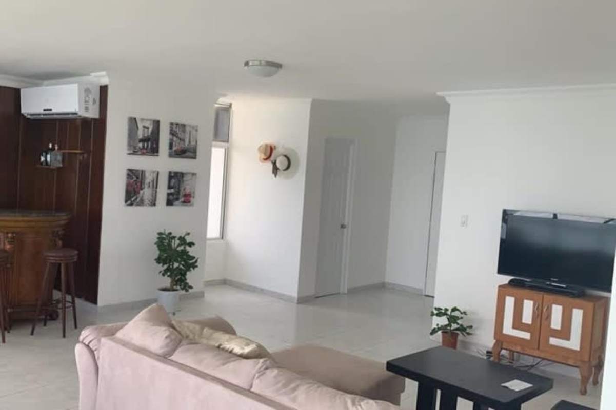 Living room with bar area air conditioner and city view PH BICSA luxury apartment Panama