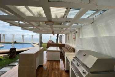 Firepit lounge area with circular seating facing the Pacific ocean at Playa Malibú Panama