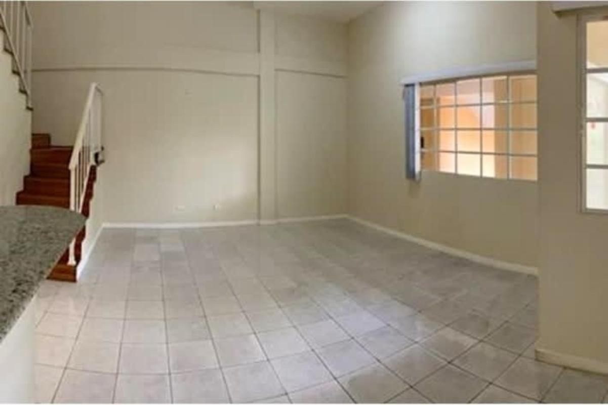 Bedroom with built-in closet, ceiling fan, large window garden view in PH Albrook Park Clayton Panama