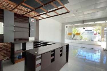 Unfinished retail or F&B interior with wood service counter in Playa Blanca Town Center