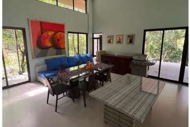 Contemporary mountain house with modern flat roof, stone accents and pergola Altos del María Panama