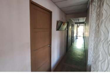 Interior hallway leading to multiple bedrooms in commercial house Barrio Balboa