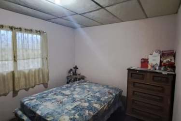 Simple bedroom or office area with window for commercial use in La Chorrera