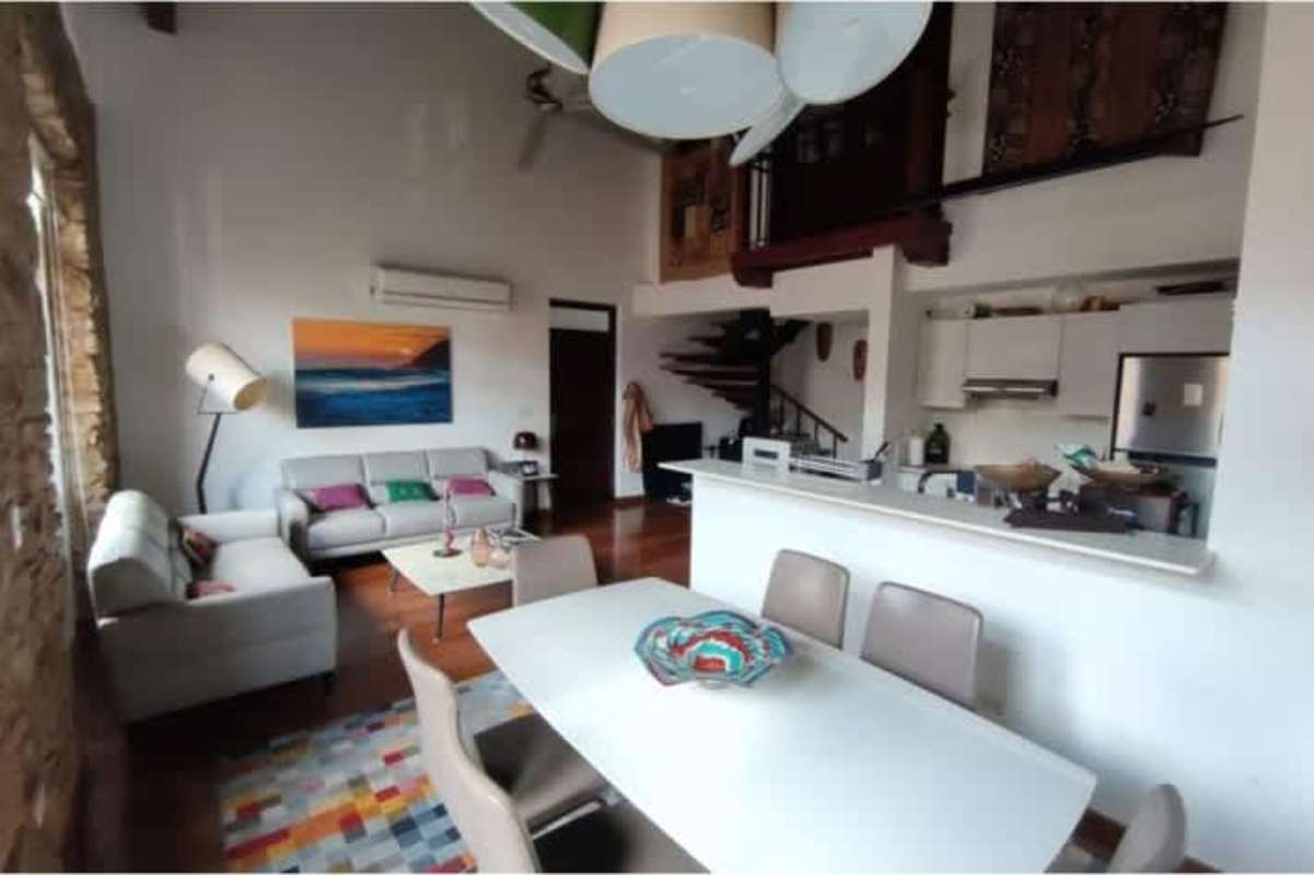 Modern kitchen appliances and wood cabinets in historic Casco Viejo apartment