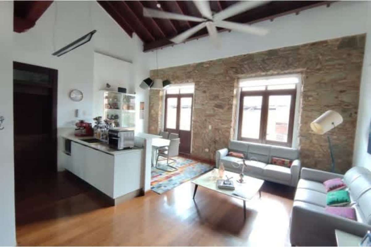 Open kitchen with dining table in furnished colonial apartment Casco Viejo Panama