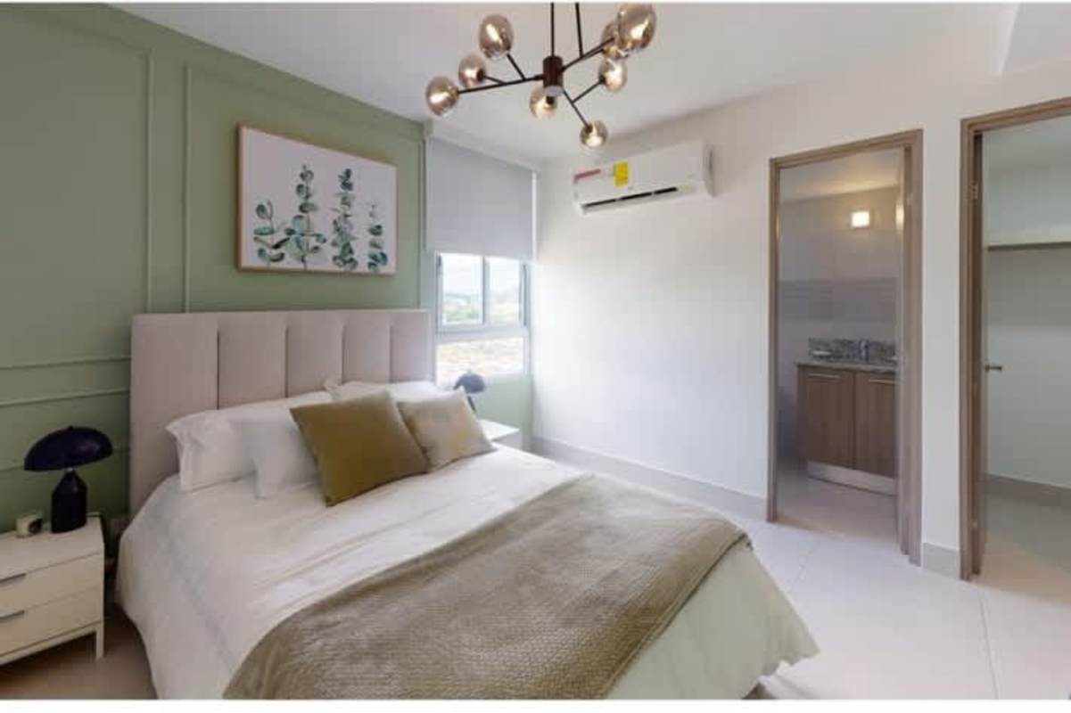 Minimalist bedroom with natural light and accent wall Greenwood Towers 200 San Miguelito