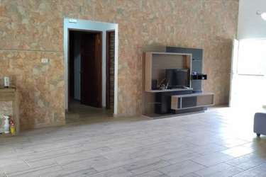 Rustic kitchen with wooden cabinets, stainless appliances in Coronado beach house Panama