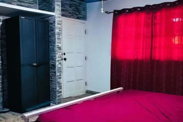 Bedroom with black wardrobe and rustic wall accents Coronado Panama