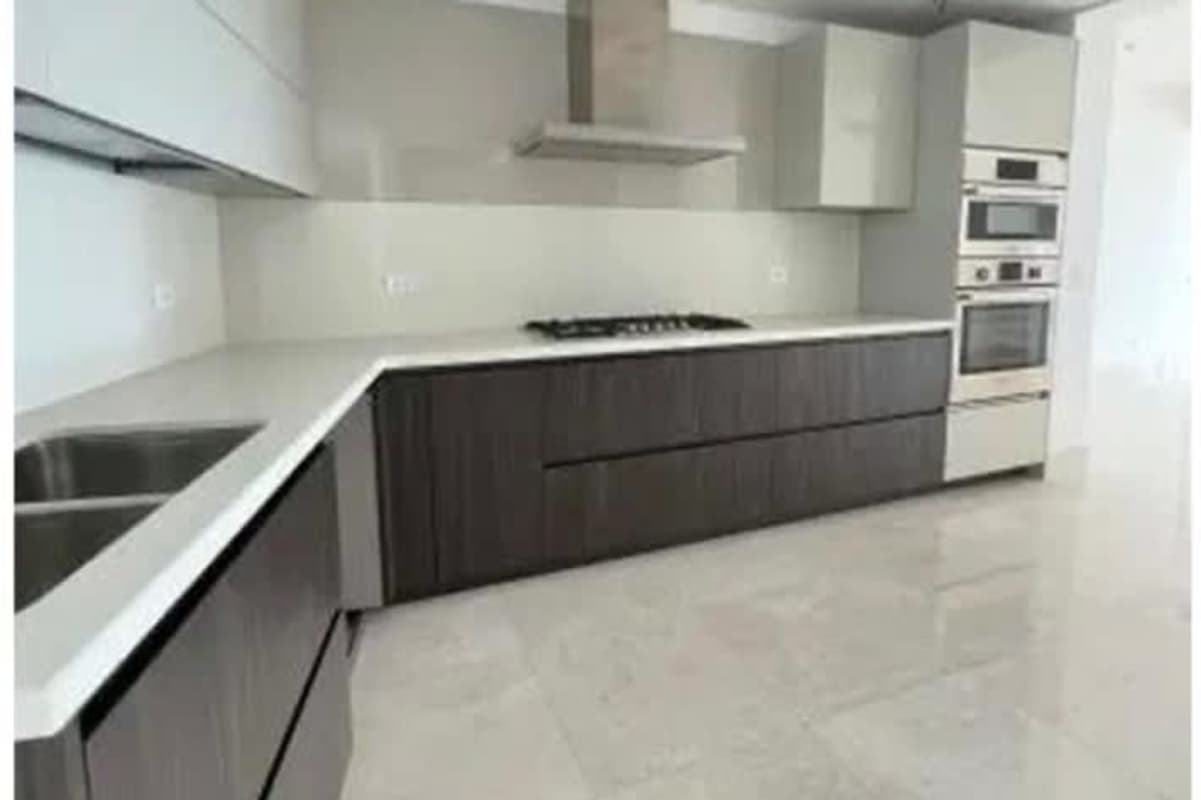 Spacious master suite with large windows and panoramic golf course view at Santa Maria luxury apartment Panama