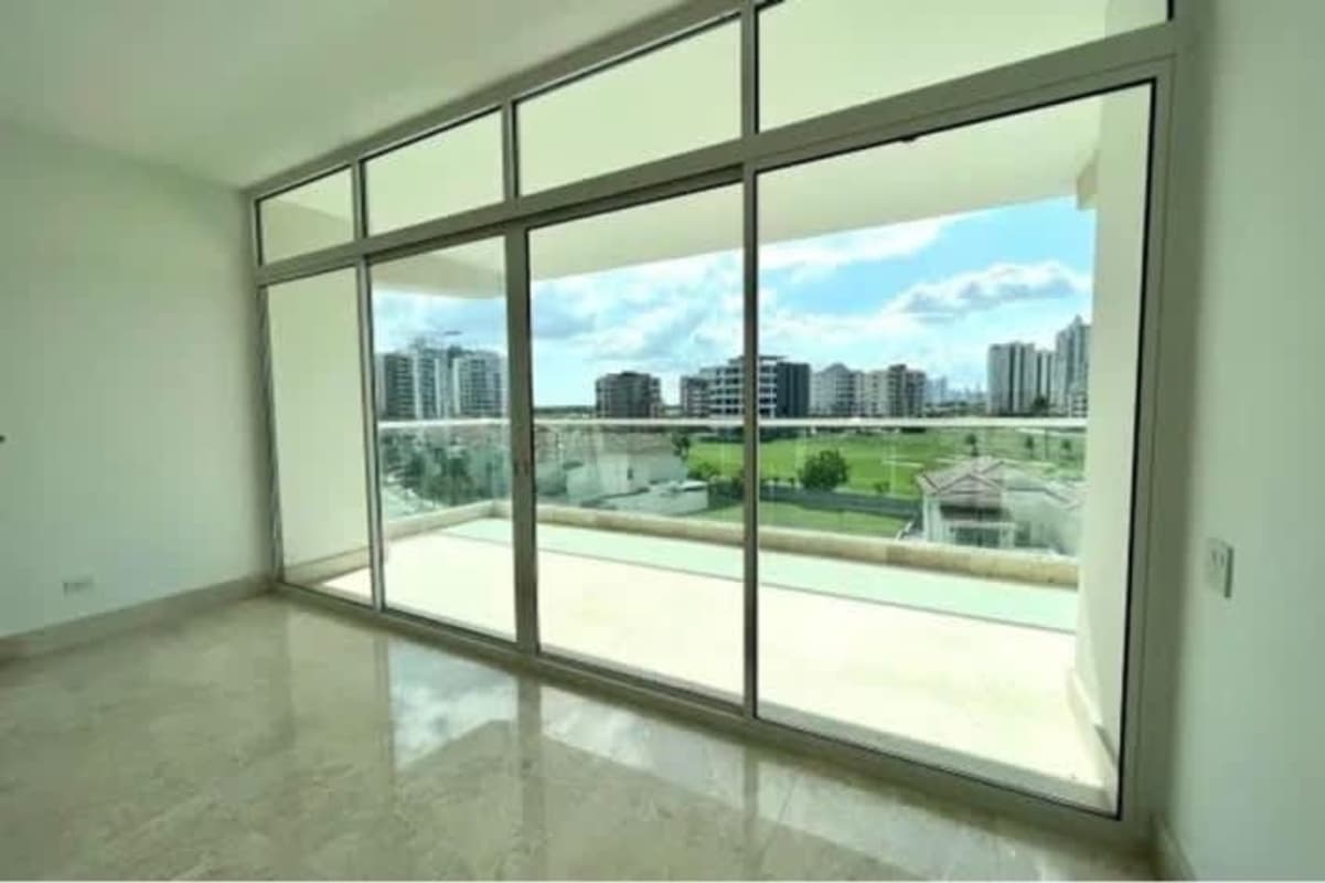 Bedroom with marble floors large windows natural light in Santa Maria Golf Apartment Panama
