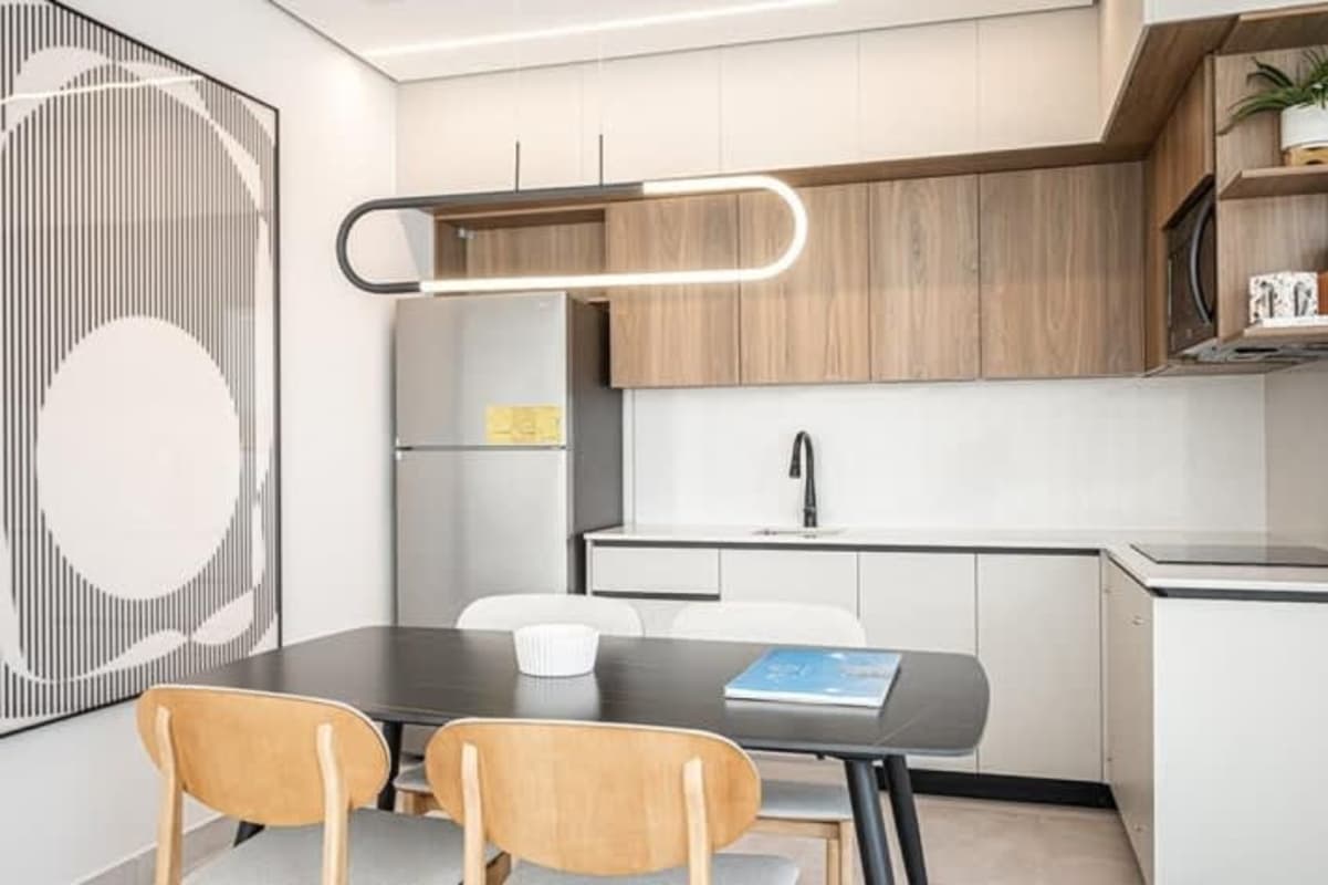 Integrated kitchen and dining area luxury airbnb apartment Costa del Este Panama