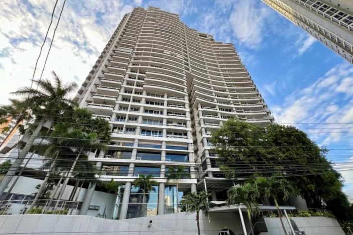 Entrance of PH Luxor Tower with lush landscaping and modern architecture El Cangrejo Panama City
