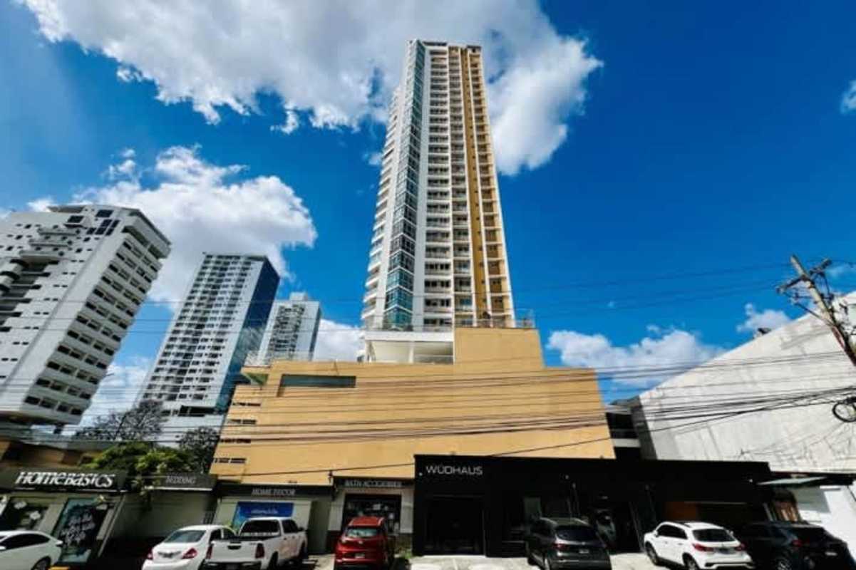 Modern high-rise apartment with balconies and glass facade PH Keops Tower Panama City