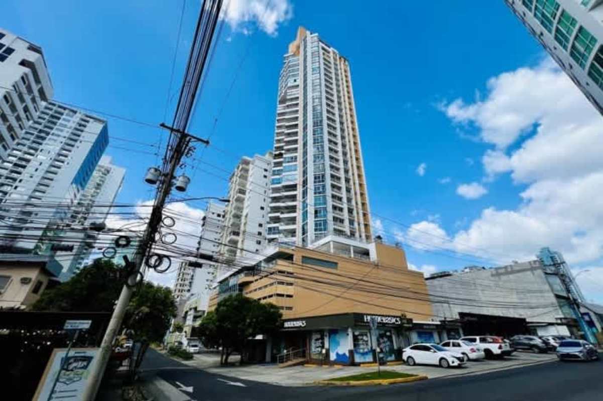 High-rise condo building with modern glass facade and balconies at PH Keops Tower Panama City