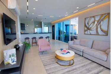 Open plan living and dining with balcony access and sea views at Ocean Waves Nueva Gorgona