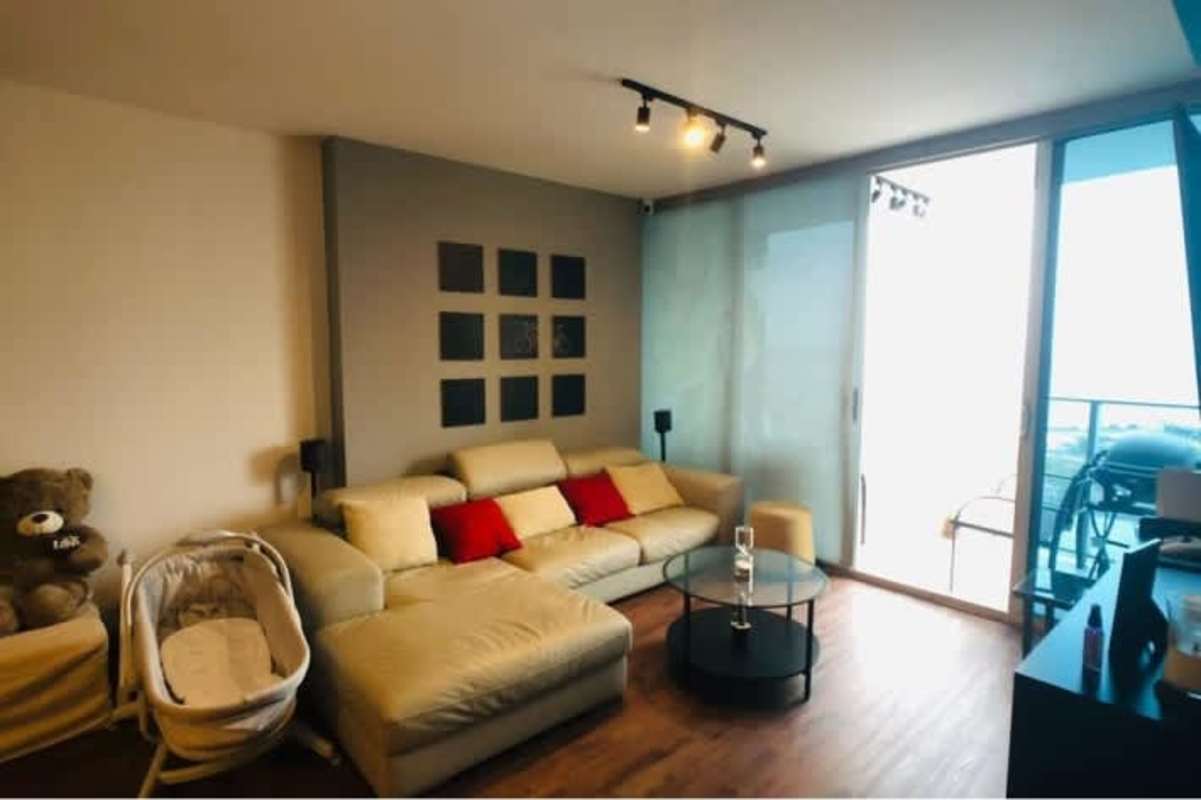 Kitchen with light wood cabinets, black countertops, refrigerator, dining table, large window PH San Francisco Bay