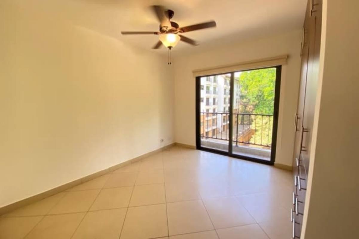 Spacious master bedroom with access to balcony, ceiling fan, garden views Clayton Forest Panama