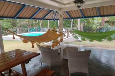 Outdoor serving window with blue tiles at Coronado Panama beach home kitchen