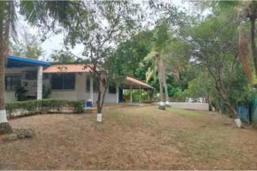 Coastal style patio with hammocks, outdoor seating, and tiled floor in Coronado Panama
